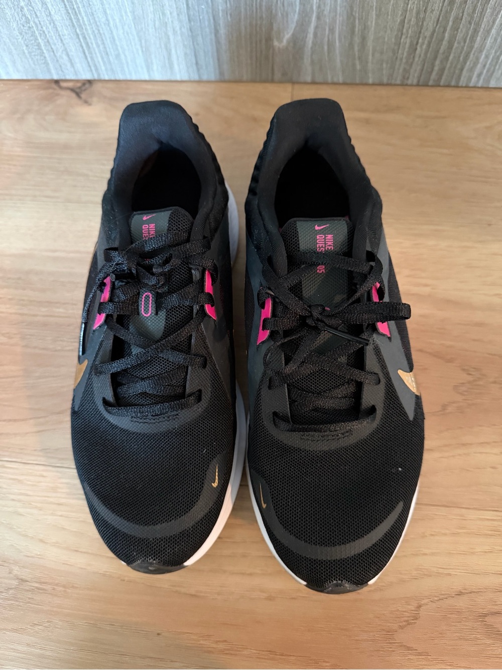 Nike Black Sneakers with Pink and Gold Accents